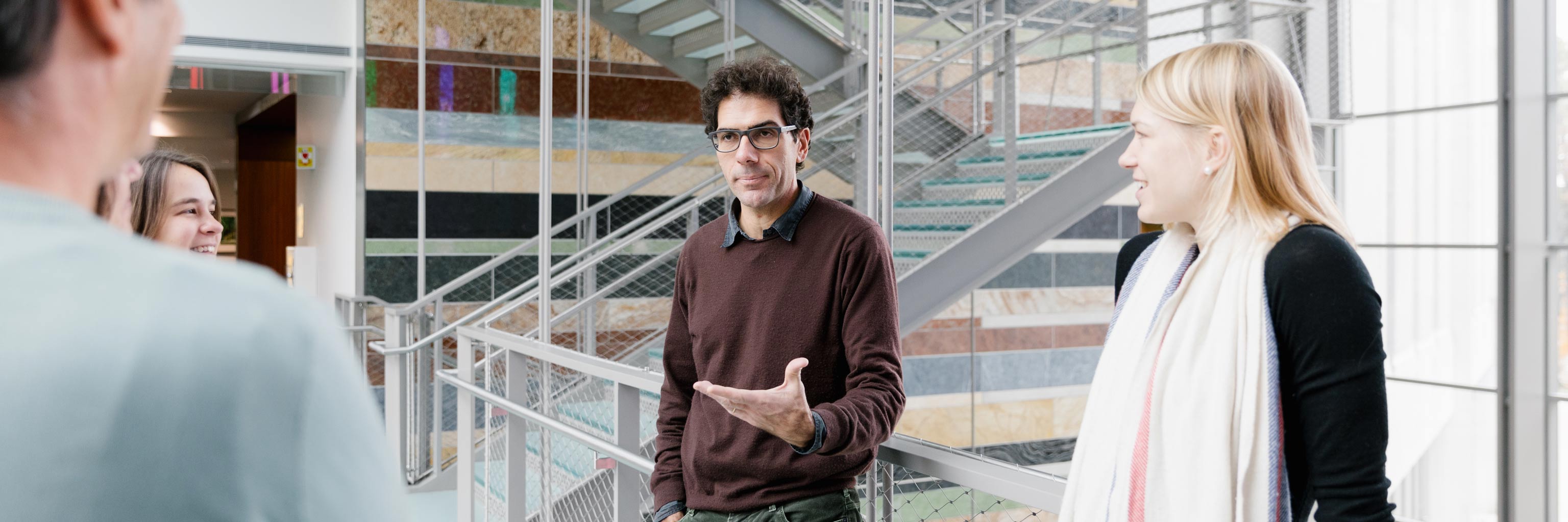 Members of the Spanish and Portuguese Department converse in the Global and International Studies Building
