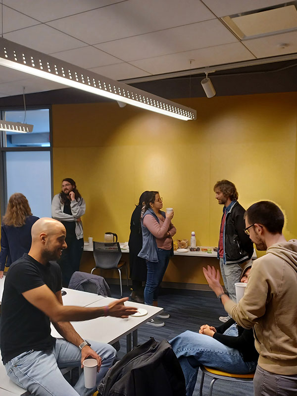 La Tertulia participants converse.