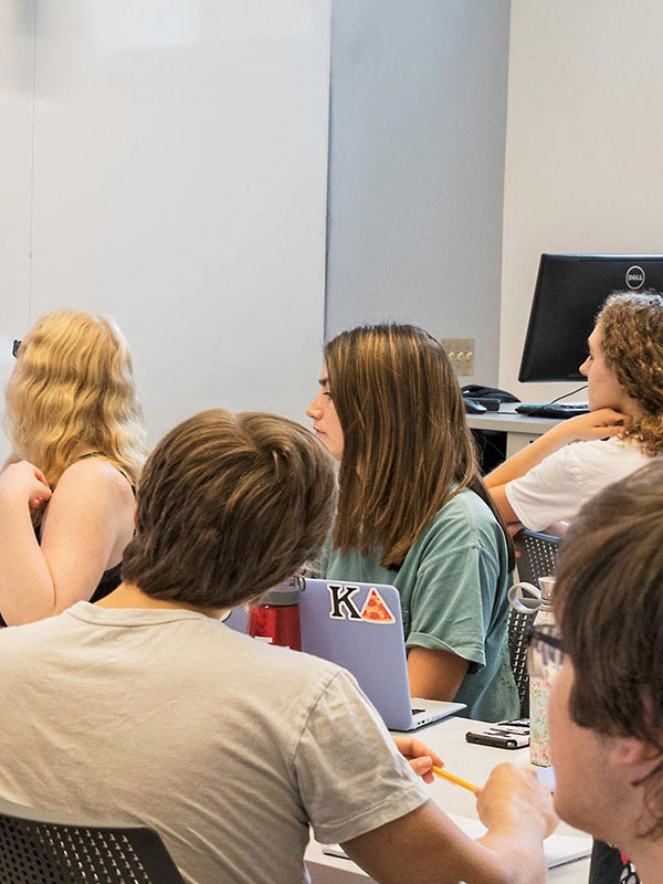 A group of students in a classroom.
